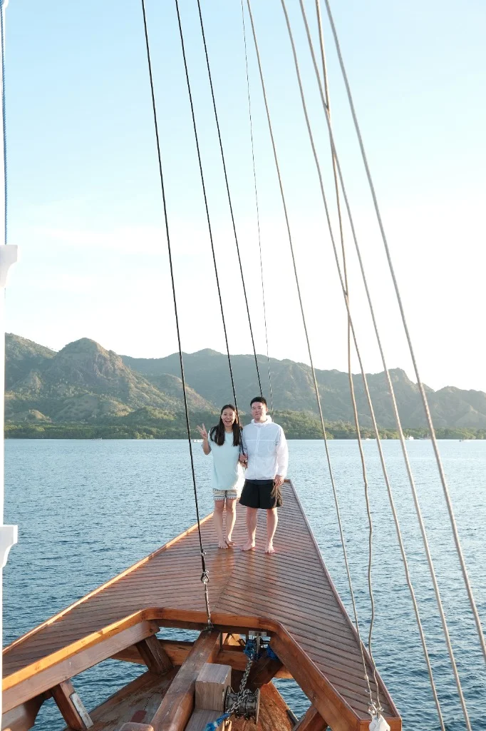 Chasing the ocean breeze at the bow of the Phinisi