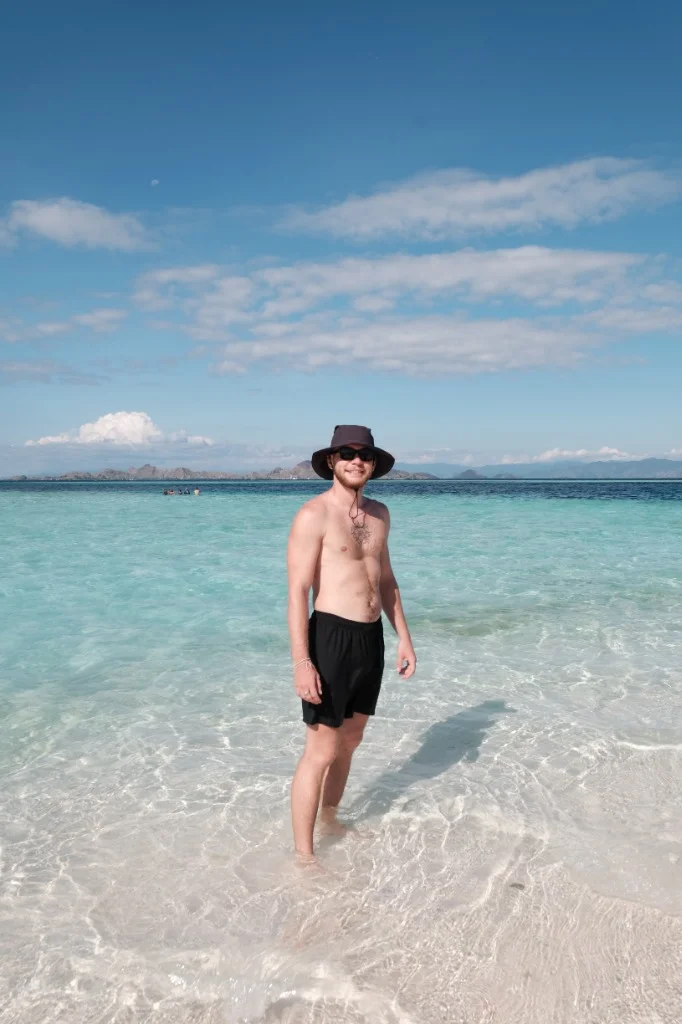 Walking in the pristine shallow waters of Komodo