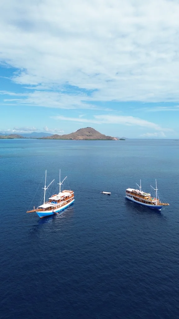 Spectacular seascape with Arfisyana anchored among Phinisi fleet